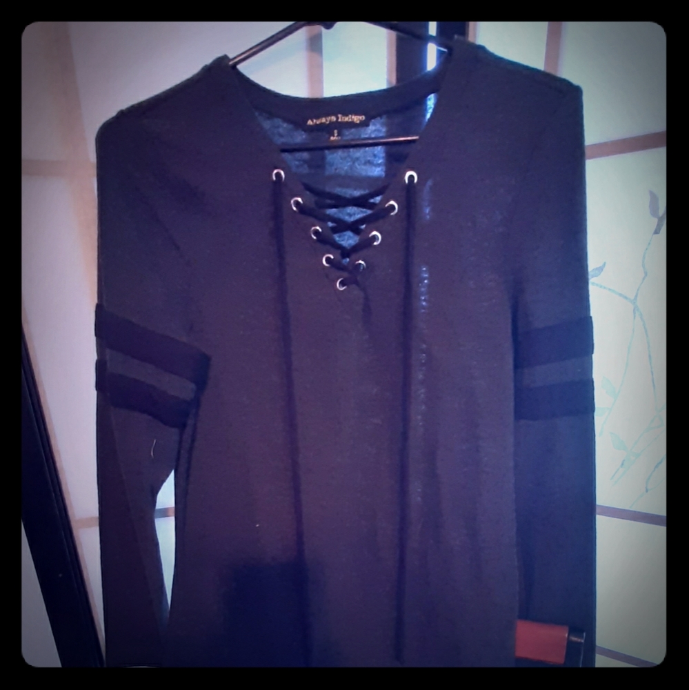 Black long sleeved top with crisscross front